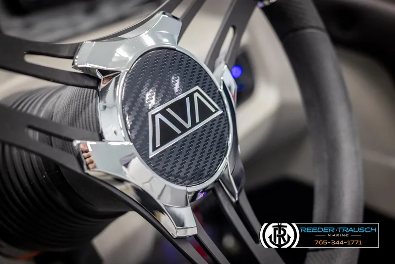Slide: The Image of Close-up of 2025 Avalon LSZ QLS steering wheel with logo and chrome accents. - 28