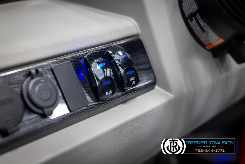 Slide: The Image of Control panel of 2025 Avalon LSZ QLS boat with switches and logo. - 29