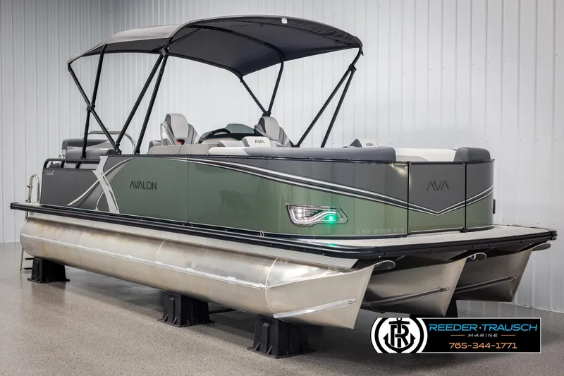 Slide: The Image of 2025 Avalon LSZ QLS pontoon boat with canopy in showroom. - 3