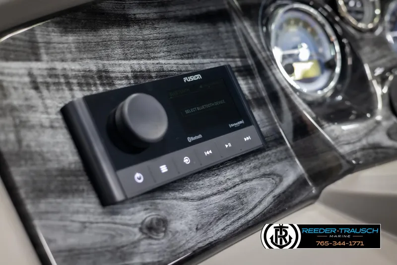 Slide: The Image of 2025 Avalon LSZ QLS dashboard with Fusion audio system and sleek wood finish. - 30