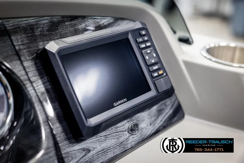 Slide: The Image of Garmin display on 2025 Avalon LSZ QLS boat dashboard, Reeder-Trausch Marine logo visible. - 34