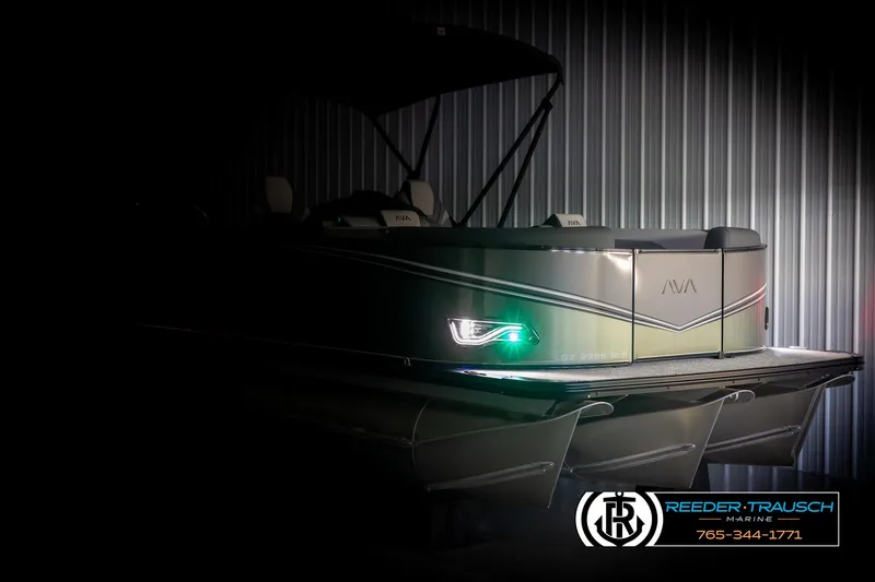 Slide: The Image of 2025 Avalon LSZ QLS pontoon boat in dimly lit storage. - 4