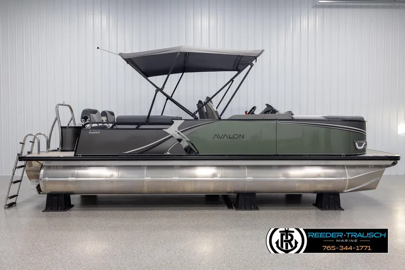 Slide: The Image of 2025 Avalon LSZ QLS pontoon boat with canopy in showroom. - 5