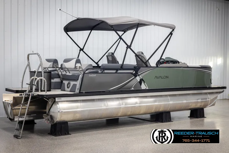 Slide: The Image of 2025 Avalon LSZ QLS pontoon boat with canopy in showroom display. - 6