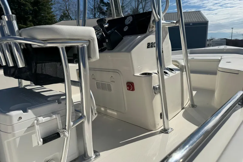 Slide: The Image of 2026 Bulls Bay 2200 XS boat interior with console and seating, showcasing sleek design. - 13