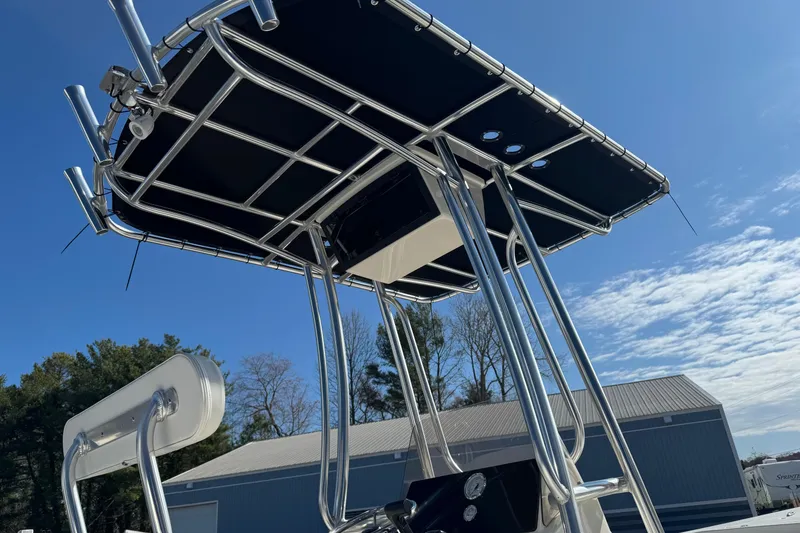 Slide: The Image of 2026 Bulls Bay 2200 XS boat with T-top under clear blue sky. - 14