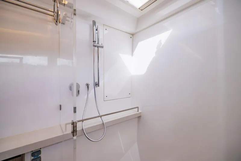 Slide: The Image of Modern shower area in 2024 Leopard 45 yacht with sleek design and glass door. - 13