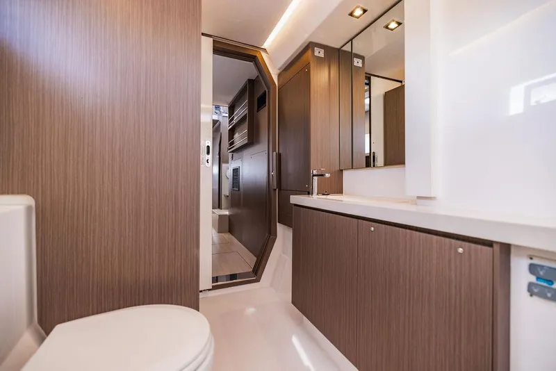 Slide: The Image of Luxurious bathroom interior of 2024 Leopard 45 yacht with modern wood cabinetry. - 15