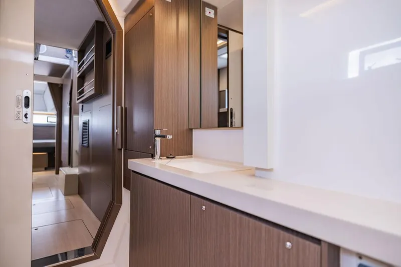 Slide: The Image of Modern bathroom interior in 2024 Leopard 45 yacht, featuring sleek wood cabinetry and minimalist design. - 16