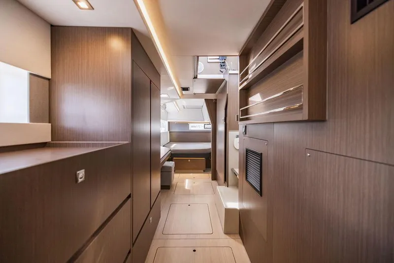 Slide: The Image of Interior of 2024 Leopard 45 yacht, featuring modern wood paneling and sleek design. - 17