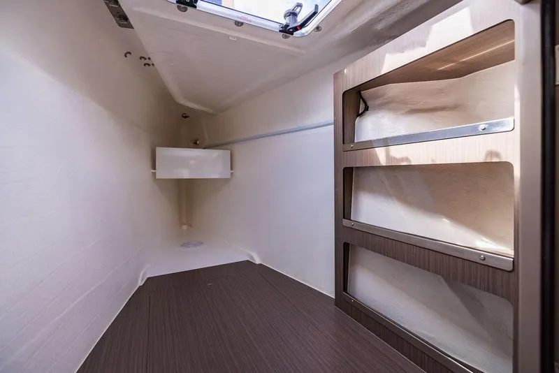 Slide: The Image of Interior cabin of 2024 Leopard 45 yacht with wooden flooring and shelving. - 2