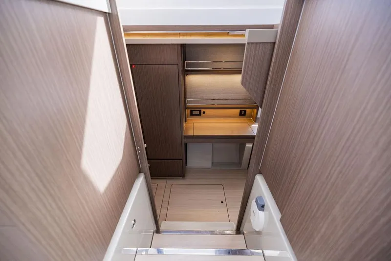 Slide: The Image of Interior view of 2024 Leopard 45 yacht, featuring modern wood cabinetry and sleek design. - 20