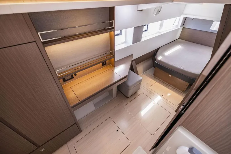 Slide: The Image of Luxurious interior of 2024 Leopard 45 yacht with modern wood finishes and cozy sleeping area. - 21