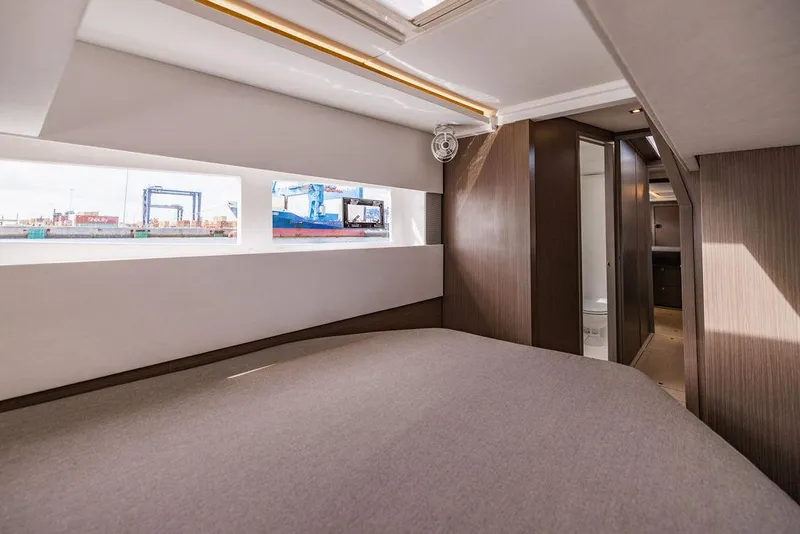 Slide: The Image of Luxurious interior of 2024 Leopard 45 yacht cabin with modern design and large windows. - 25