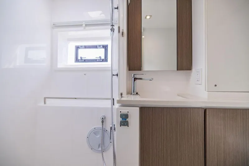 Slide: The Image of Modern bathroom interior on 2024 Leopard 45 yacht, featuring sleek fixtures and wood accents. - 28