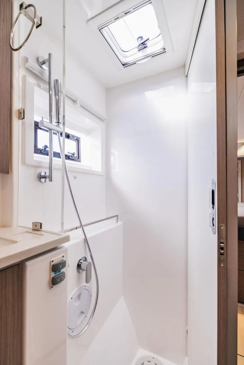 Slide: The Image of Modern bathroom in 2024 Leopard 45 yacht with skylight and sleek shower design. - 40