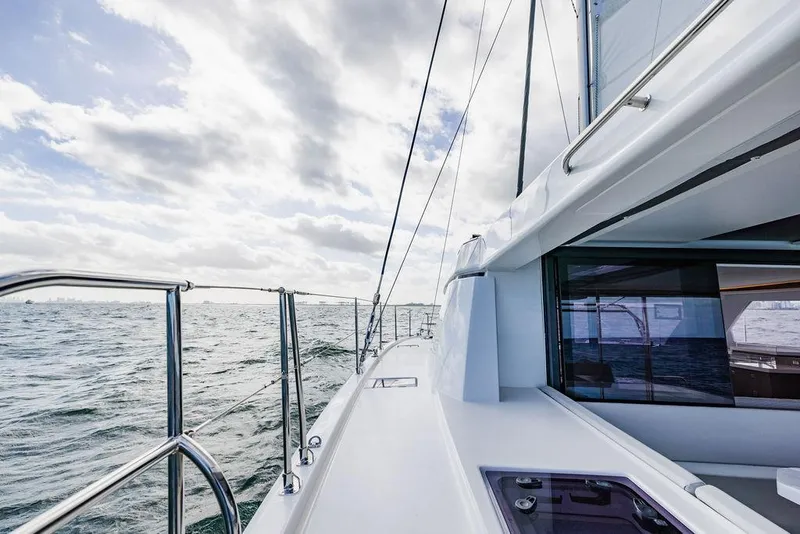 Slide: The Image of 2024 Leopard 45 yacht sailing on open sea under cloudy skies. - 47