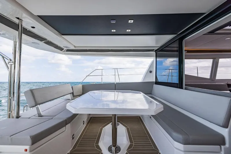 Slide: The Image of Luxurious 2024 Leopard 45 yacht interior with ocean view and modern seating area. - 49