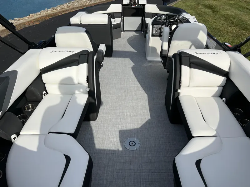Slide: The Image of 2025 South Bay 222RS boat interior with white and black seating, modern design. - 17