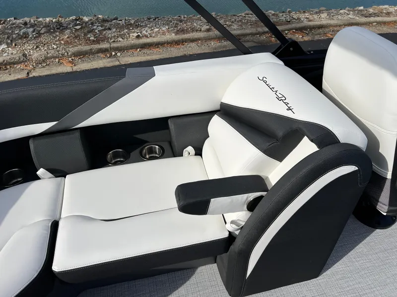 Slide: The Image of 2025 South Bay 222RS boat interior with sleek white and black seating. - 18