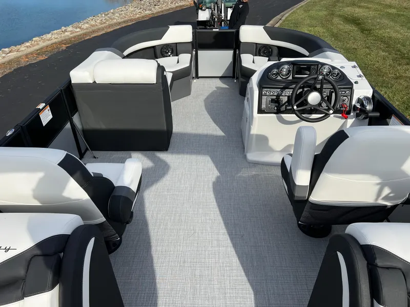 Slide: The Image of 2025 South Bay 222RS pontoon boat interior with modern seating and steering console. - 19
