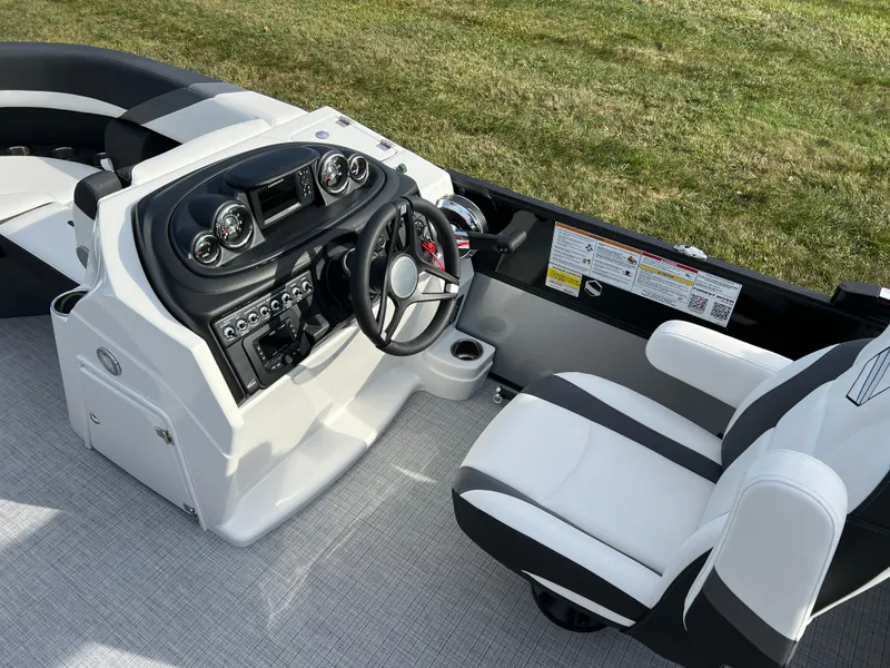 Slide: The Image of 2025 South Bay 222RS boat interior with modern dashboard and seating. - 21