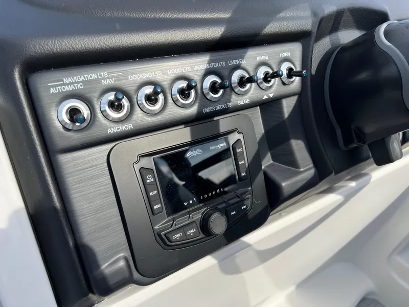 Slide: The Image of Control panel of 2025 South Bay 222RS boat with navigation and audio system. - 22
