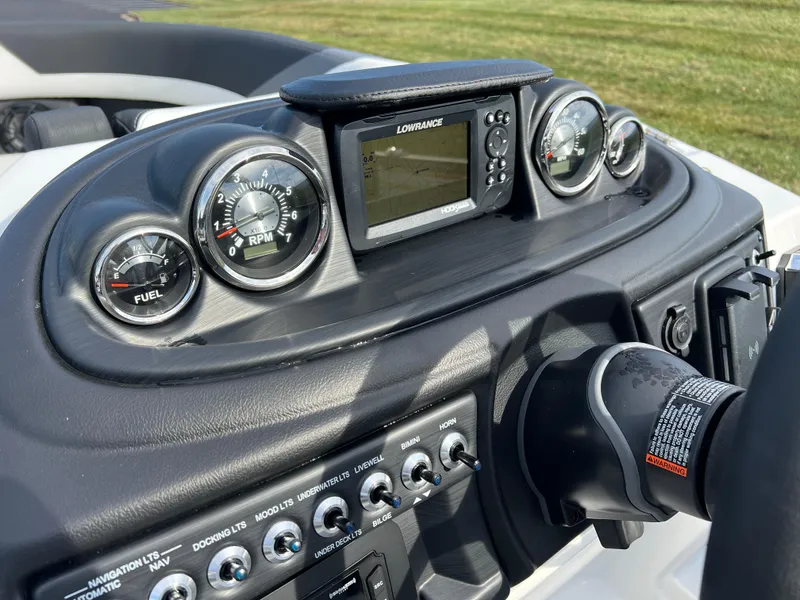 Slide: The Image of Dashboard of 2025 South Bay 222RS boat with gauges and Lowrance display. - 23
