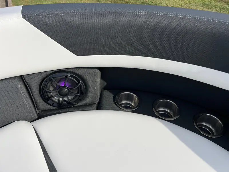 Slide: The Image of 2025 South Bay 222RS boat interior with speaker and cup holders. - 27