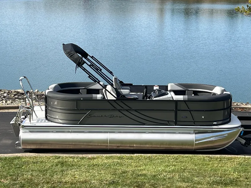 The Image of 2025 South Bay 220RS pontoon boat by a serene lake. - 0