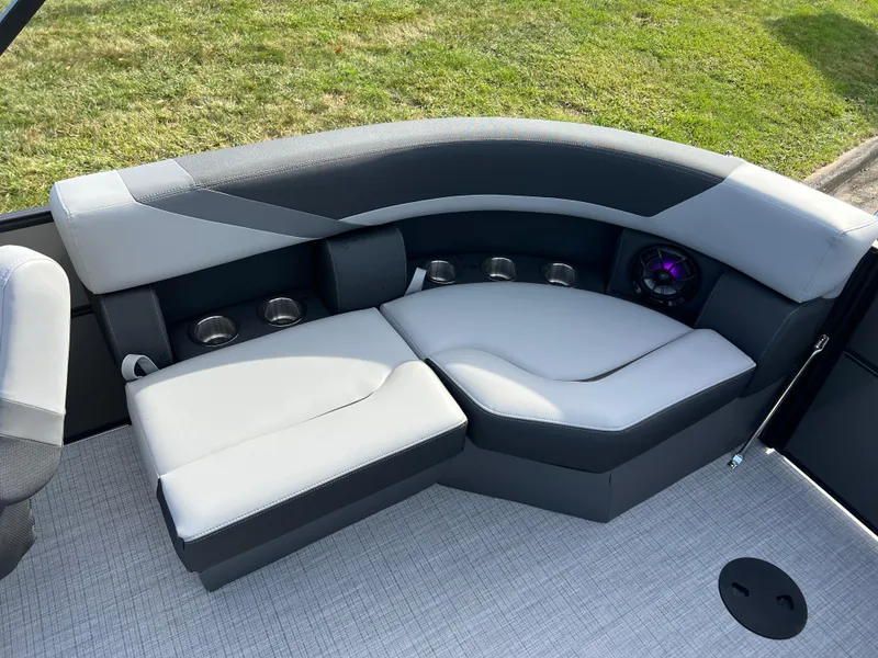 Slide: The Image of 2025 South Bay 220RS boat interior with sleek gray seating and modern design. - 12