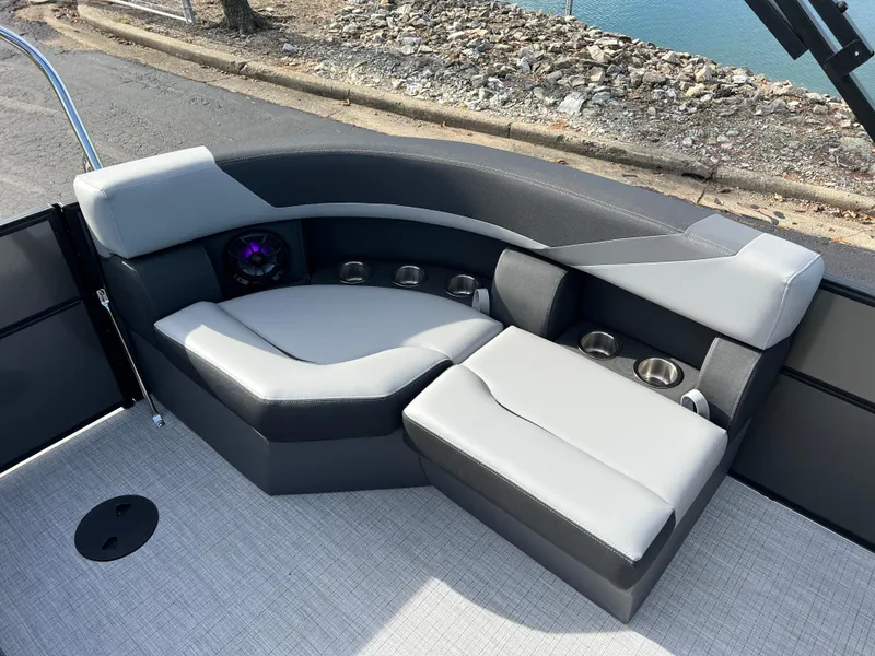 Slide: The Image of Luxurious seating on 2025 South Bay 220RS pontoon boat with cup holders and speaker. - 13