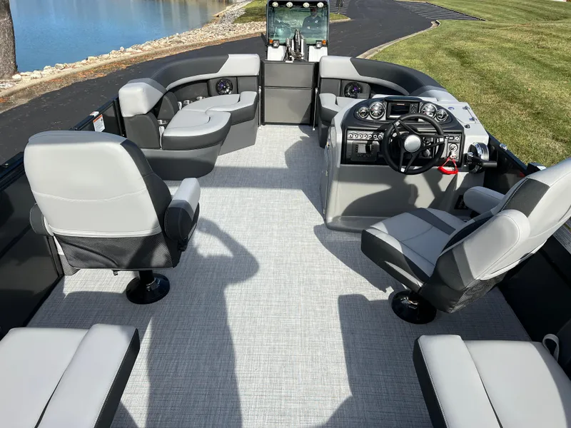 Slide: The Image of 2025 South Bay 220RS pontoon boat interior with modern seating and steering console. - 15