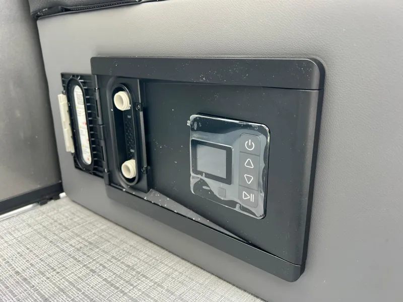 Slide: The Image of Control panel of 2025 South Bay 220RS boat, featuring digital display and buttons. - 16