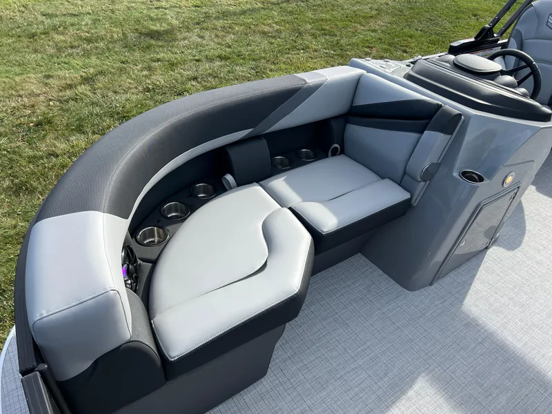 Slide: The Image of 2025 South Bay 220RS boat interior with sleek gray seating and cup holders. - 8