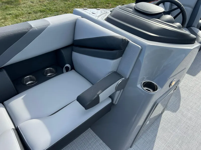 Slide: The Image of 2025 South Bay 220RS boat interior with gray seating and cup holders. - 9