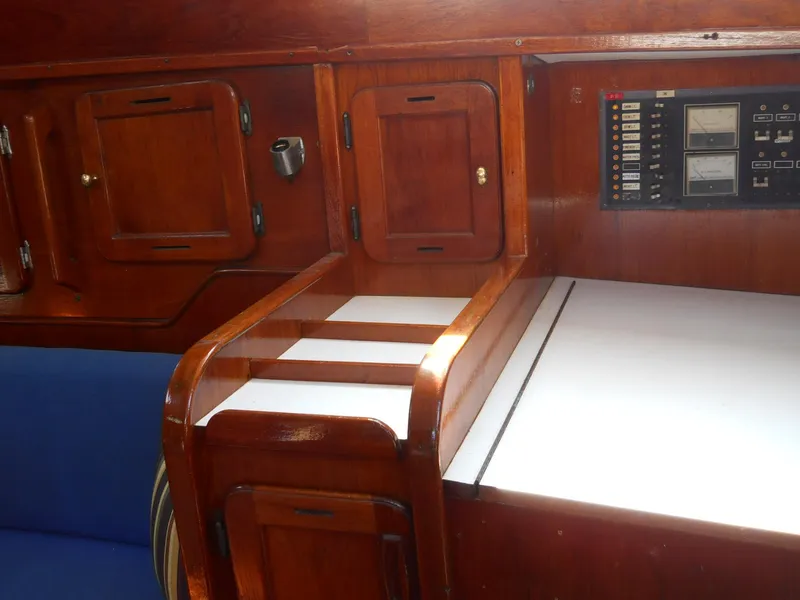 Slide: The Image of 1979 Morgan 382 yacht interior with wooden cabinetry and control panel. - 13