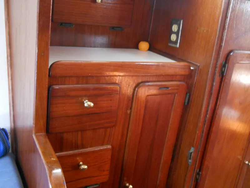 Slide: The Image of 1979 Morgan 382 yacht interior with wooden cabinetry and drawers. - 4