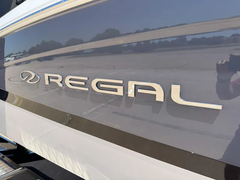 Slide: The Image of 2025 Regal LS2 Surf boat logo on sleek exterior. - 15