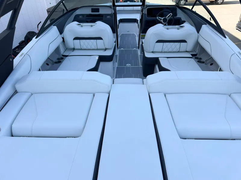 Slide: The Image of 2025 Regal LS2 Surf boat interior with luxurious white seating and modern design. - 18