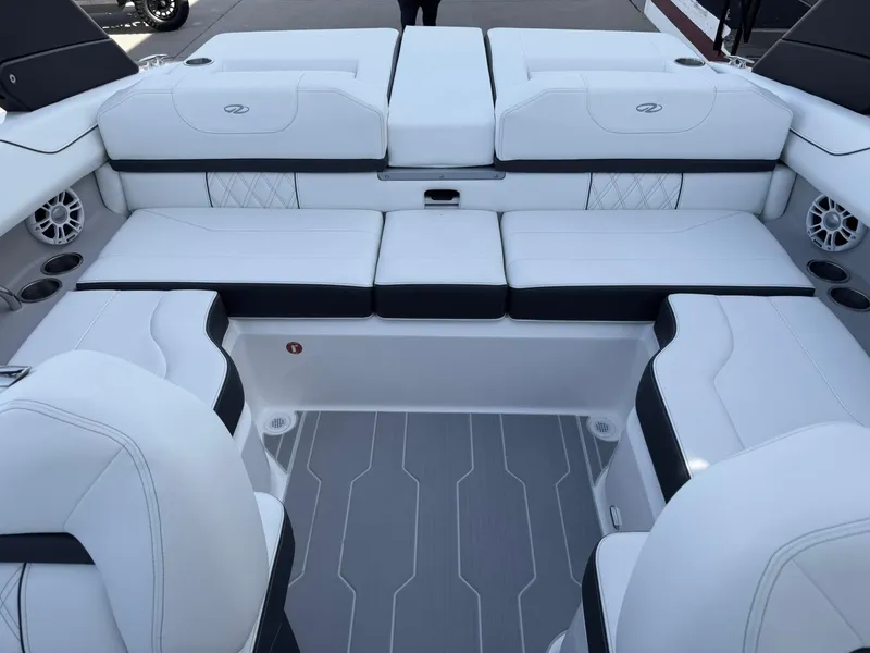Slide: The Image of 2025 Regal LS2 Surf boat interior with white seating and modern design. - 25