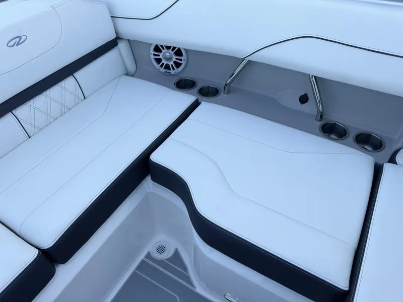 Slide: The Image of Luxurious seating in the 2025 Regal LS2 Surf boat with cup holders and speaker. - 26
