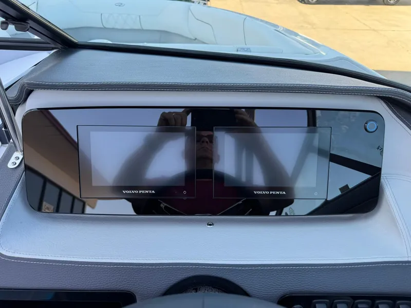 Slide: The Image of 2025 Regal LS2 Surf dashboard with dual Volvo Penta displays. - 29