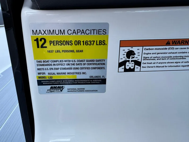 Slide: The Image of 2025 Regal LS2 Surf boat capacity label: 12 persons or 1637 lbs, safety compliance details. - 31