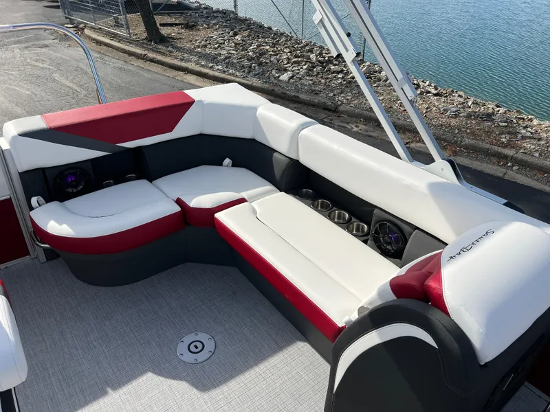 Slide: The Image of Luxurious seating on 2025 South Bay S 220 CR2 pontoon boat by the water. - 13
