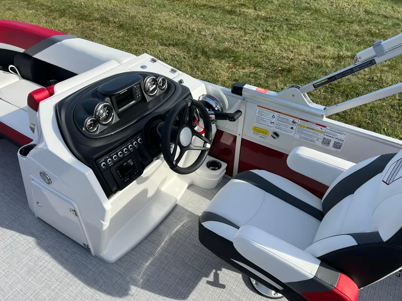 Slide: The Image of 2025 South Bay S 220 CR2 boat interior with modern dashboard and seating. - 19