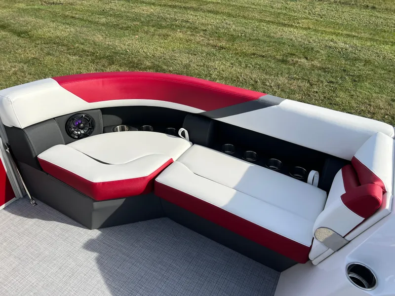 Slide: The Image of 2025 South Bay S 220 CR2 boat interior with red and white seating. - 24