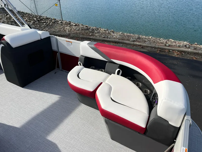 Slide: The Image of 2025 South Bay S 220 CR2 pontoon boat with stylish red and white seating. - 8