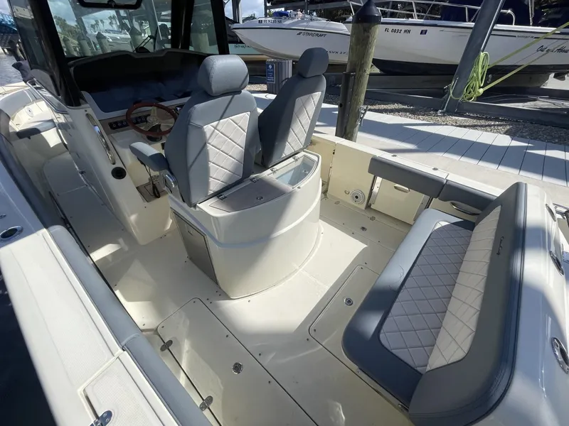 Slide: The Image of 2021 Chris-Craft Catalina 30 boat interior with luxurious seating and helm. - 4