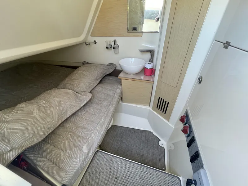 Slide: The Image of 2021 Chris-Craft Catalina 30 cabin interior with bed, sink, and modern design. - 8
